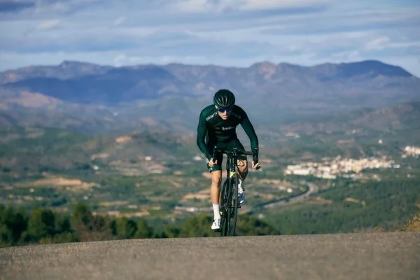 cyclist climbing mountain road
